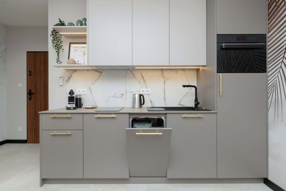 Utility area with modern washing machine – In-unit laundry for your convenience.

