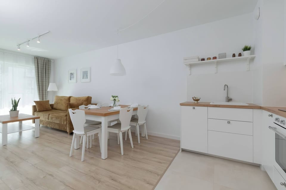 Another angle of the kitchen, showing white cabinets and countertop.