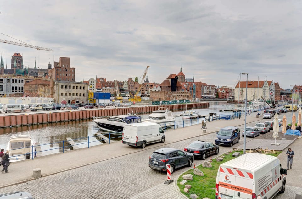 A scenic view of the city featuring historical buildings and a bustling atmosphere.