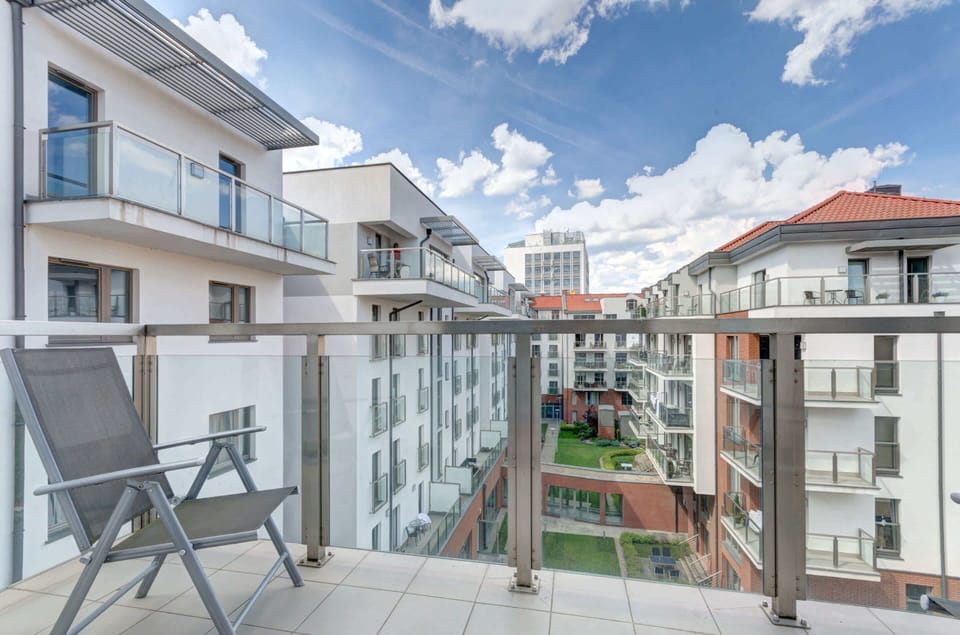 The balcony belonging to the apartment is a great place to enjoy the views and get some fresh air. 