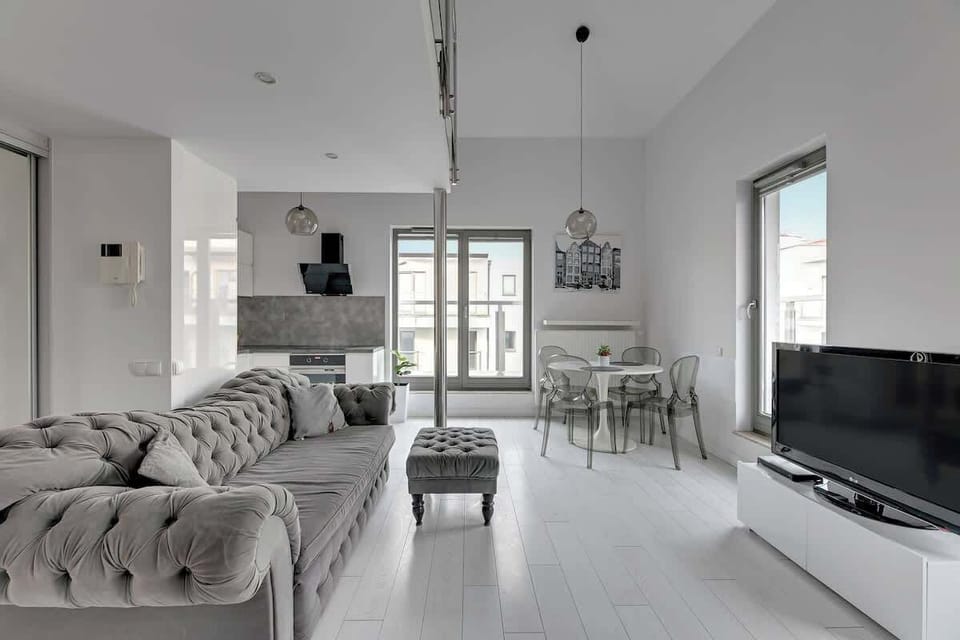 Bright and airy living area with stylish decor and plenty of natural light.