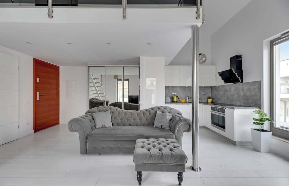 The living room combines modern elegance with cozy comfort, making it the perfect space for unwinding after a day of exploring.
