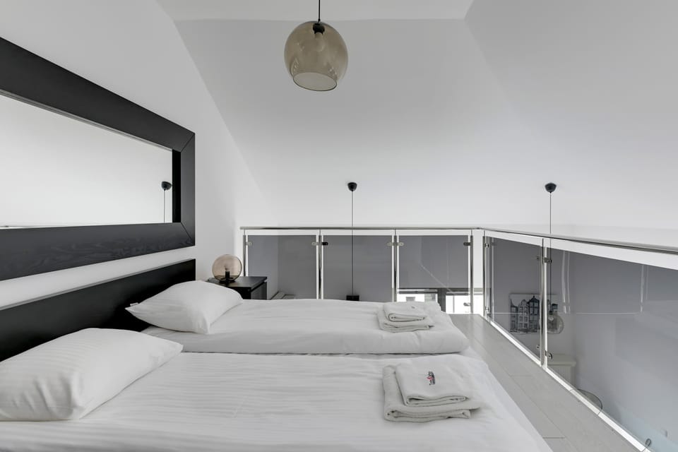 A bright bedroom with a calming ambiance, offering great views and a peaceful retreat.