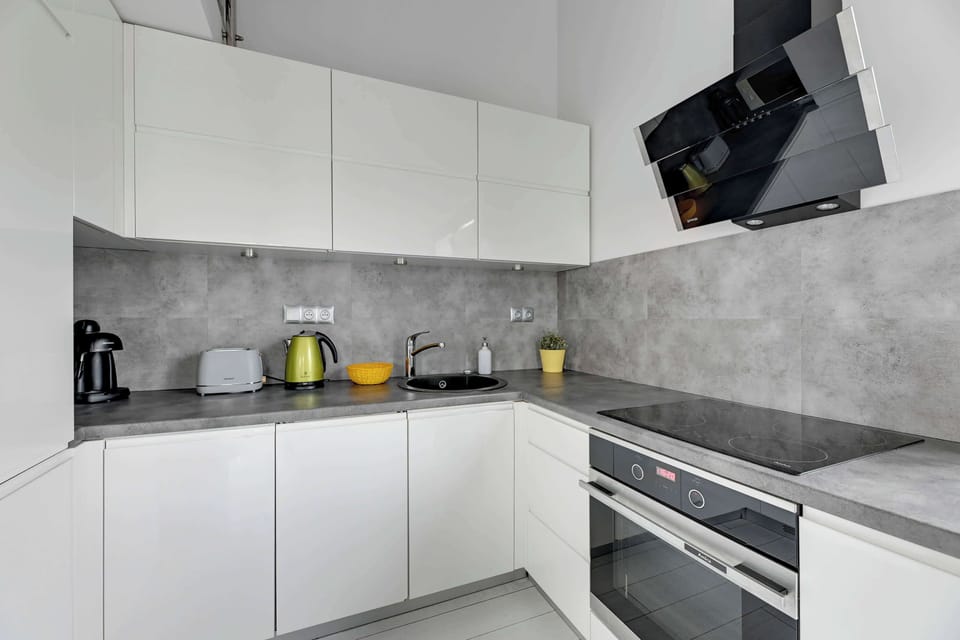 Stylish kitchen with high-end appliances and sleek countertops for culinary enthusiasts.