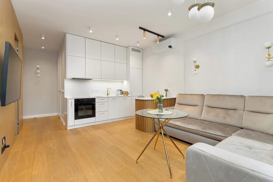 The modern kitchen, which flows seamlessly into the cosy living room, creates the perfect place for cooking and relaxing.