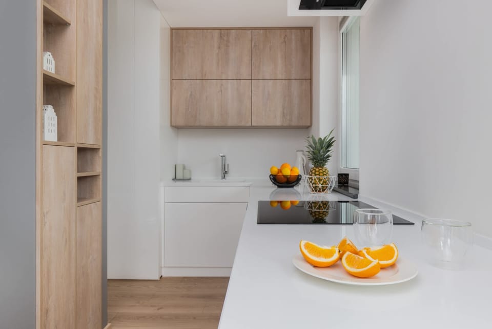 Modern kitchenette with wooden elements.