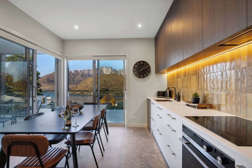 Our modern kitchen features all the appliances and cooking utensils you would expect... with some fantastic views of the mountains and lake!