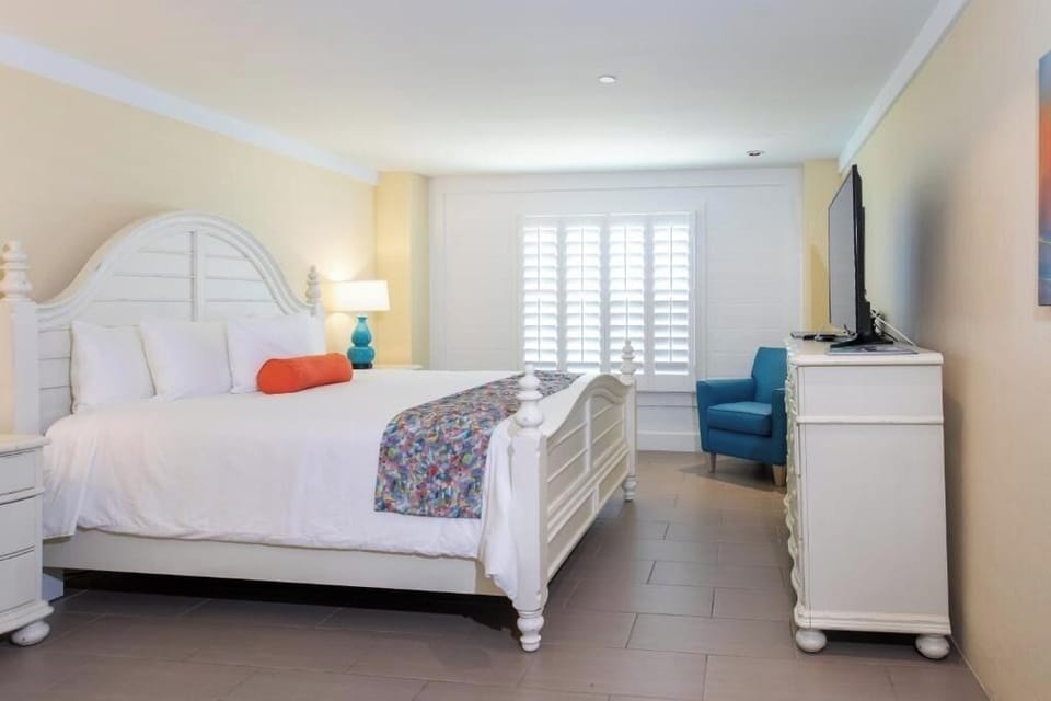 Unwind in a bright, airy bedroom with crisp linens.