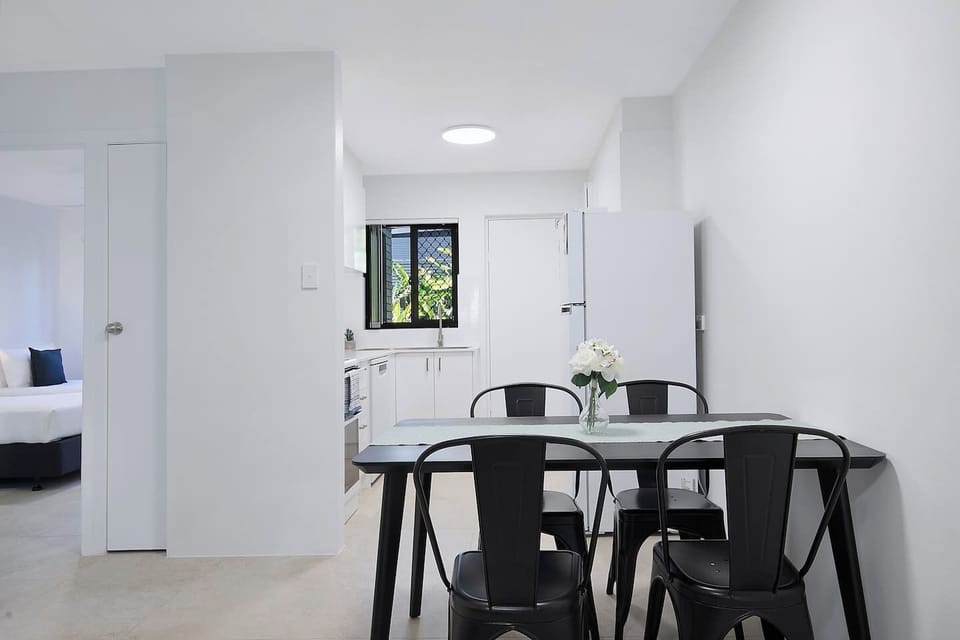 Share meals, plan your day, or simply enjoy a quiet moment at the sleek dining table for four, conveniently located beside the kitchen and filled with natural light.