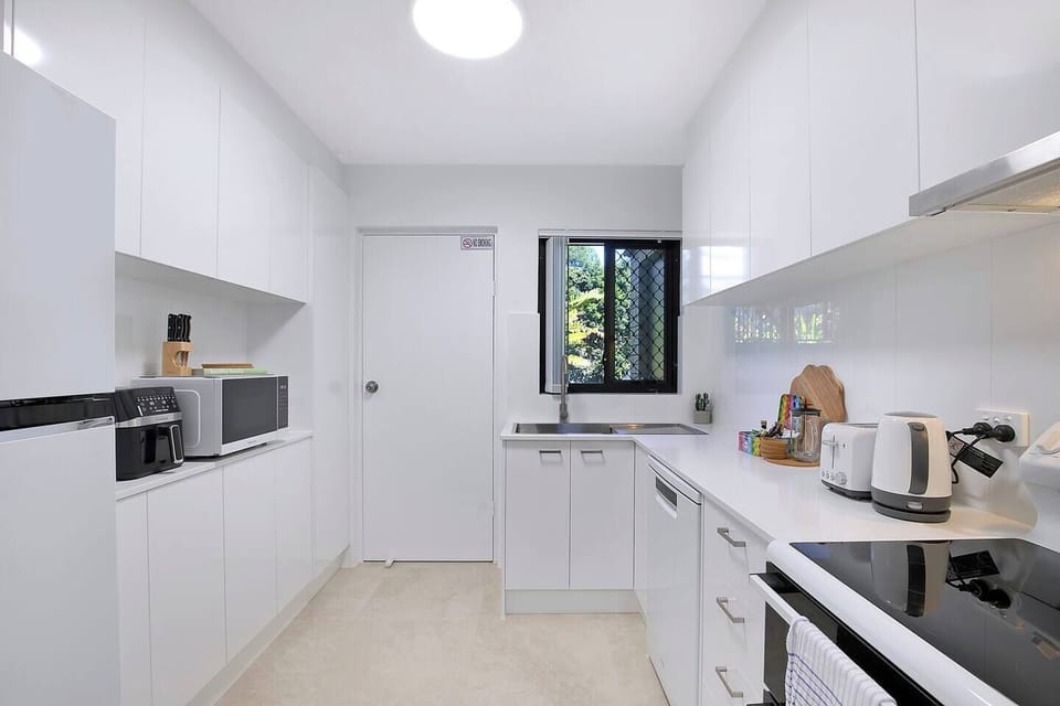 Cook up a storm in the fully equipped kitchen, complete with an air fryer, oven, stovetop, microwave, dishwasher, kettle, toaster, and prep space.