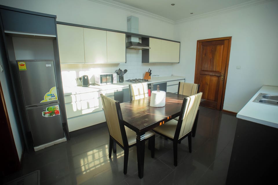 Kitchen with second dinning area os designed to blend functionality with warmth.
