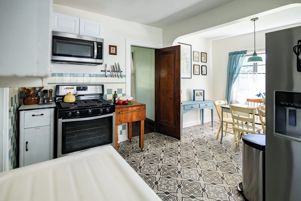 The kitchen retains much of its original charm and is the heart of the home.