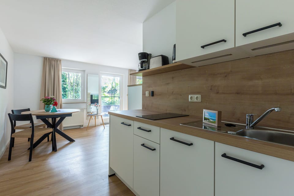 Kitchen with wooden details and table for two