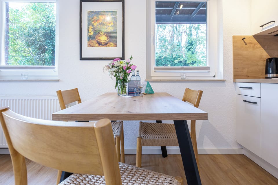 Bright kitchen with wooden table and chairs