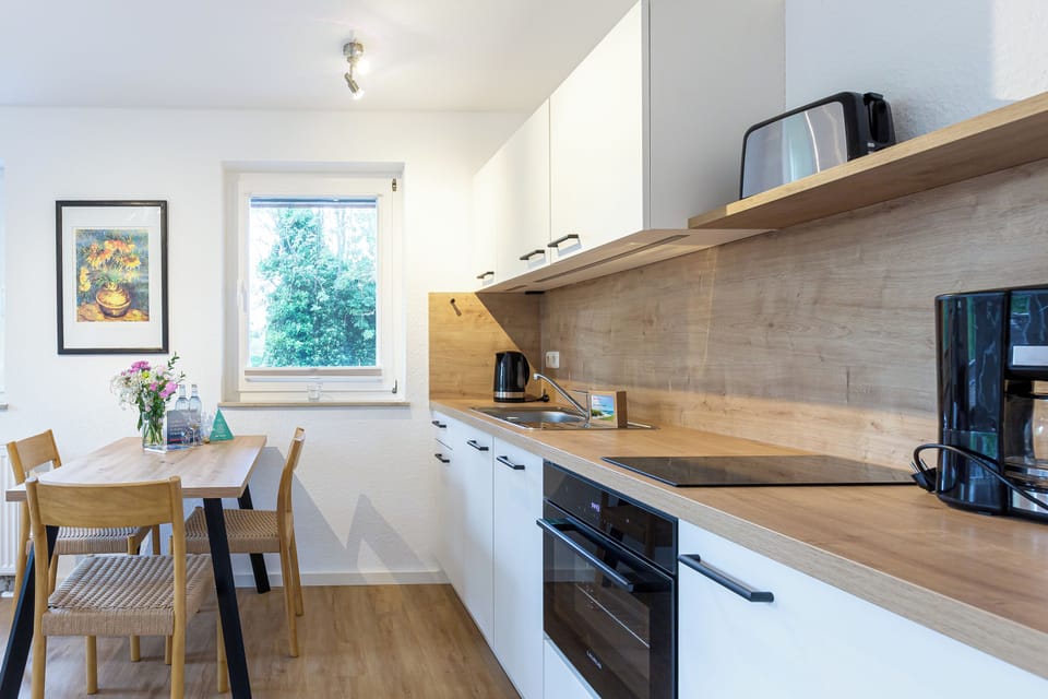 Modern Kitchen with Dining Table and Stove