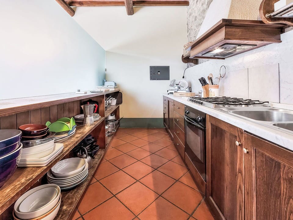 Kitchen, Countertop, Interior Design, Flooring, Wood, Furniture, Kitchen Appliance, Major Appliance, Ceiling, Cabinetry