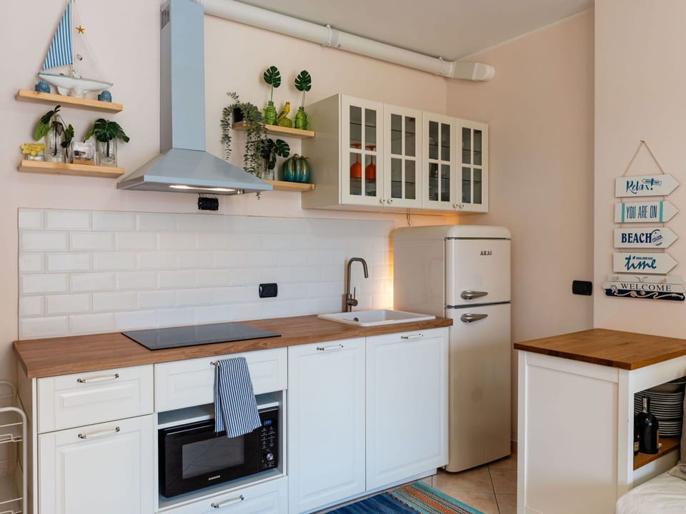 Kitchen, Cabinetry, Countertop, Furniture, Kitchen Appliance, Interior Design, Major Appliance, Flooring, Wood, Drawer