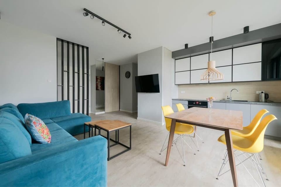 Equipped with a flat-screen TV and a cozy seating area, ideal for unwinding after a long day.