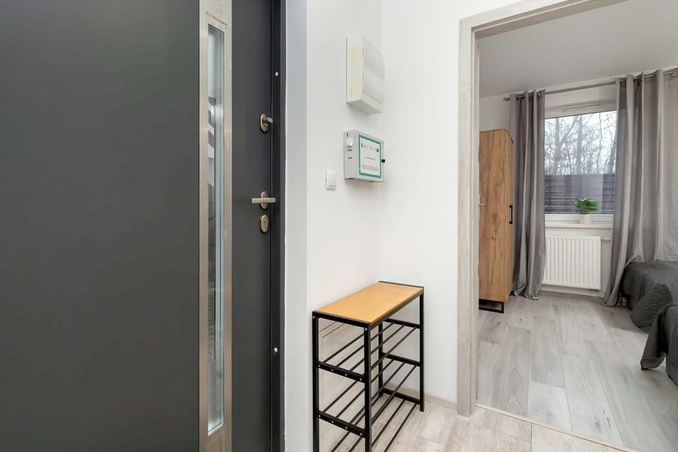 Bright hallway from which doors lead to other rooms.