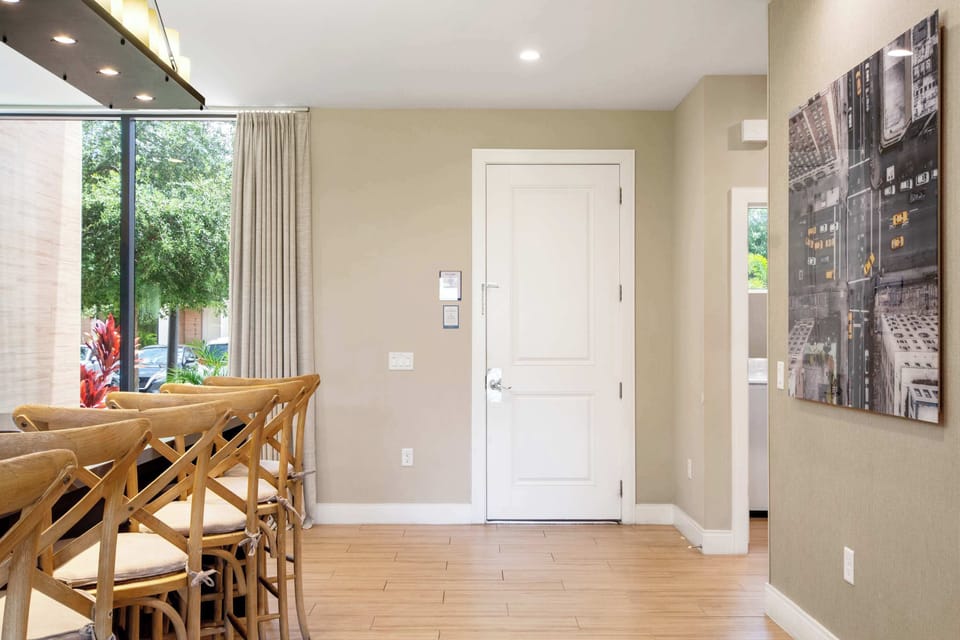 Clean entry, modern art, and stylish bar seating create a welcoming space.