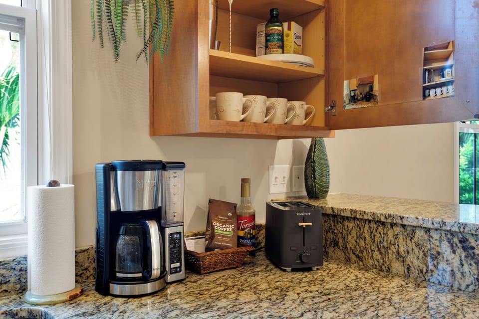 Coffee bar, equipped with various creamers and syrups. Coffee Included!
