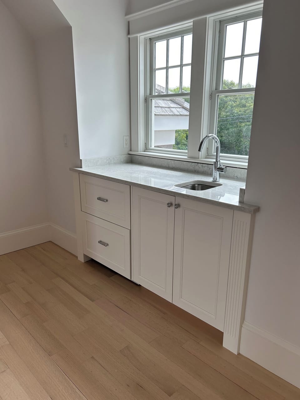 mini bar on second floor with sink , and refrigerator drawers
