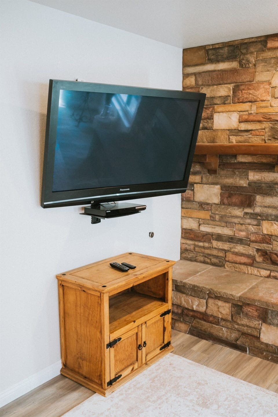 Enjoy a cinematic evening in this polished living space.
