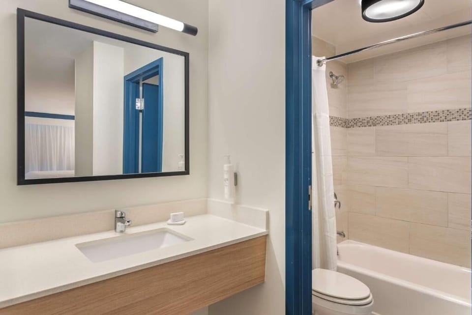 Rinse off comfortably with bright lighting and plenty of counter space.