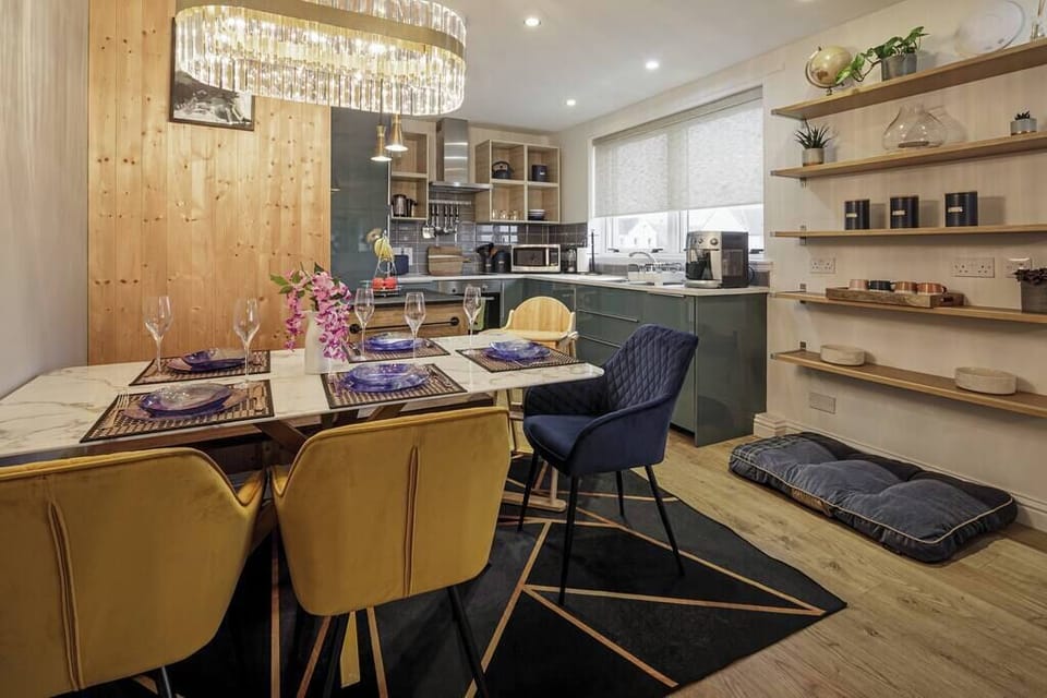 Dining area with folding highchair.
Dog bed and bowls provided.