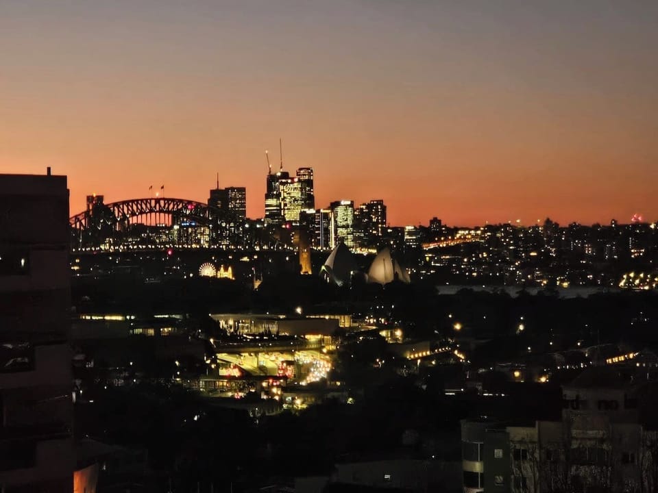 Stunning night views of Sydney Harbour from the shared rooftop.