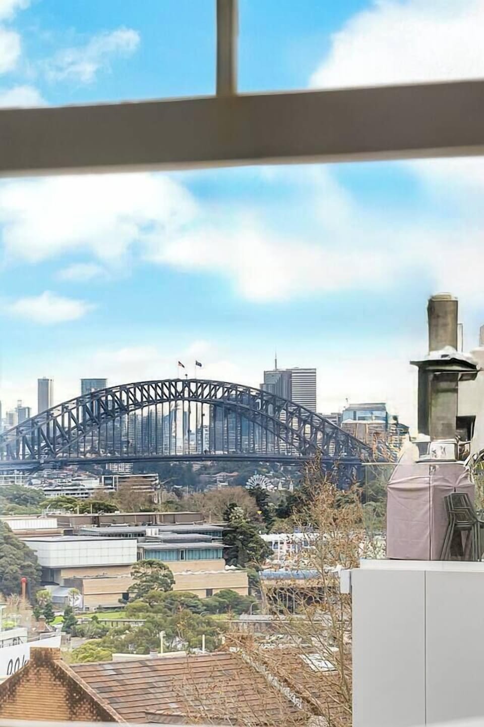 Catch iconic Harbour Bridge glimpses from the bathroom—a distinctly Sydney view to start your day.
