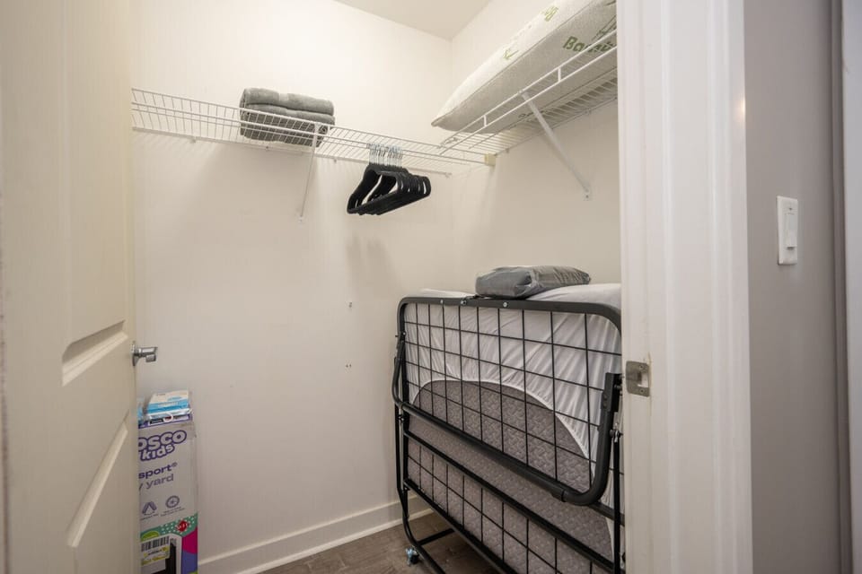 This convenient walk-in closet offers extra storage and helpful amenities for your stay.