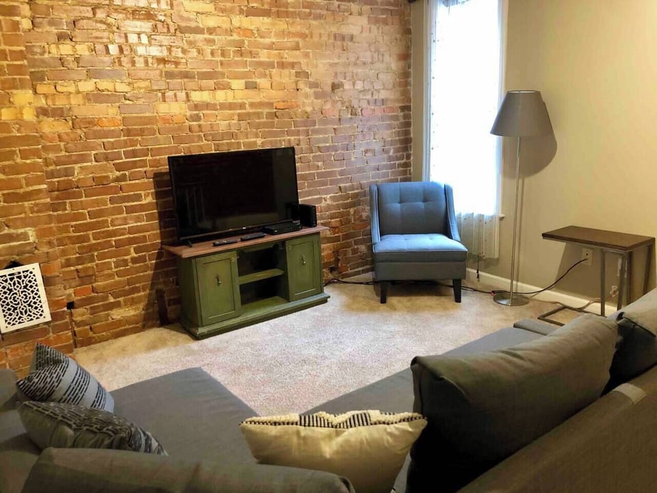 TV room with lounging sofa.