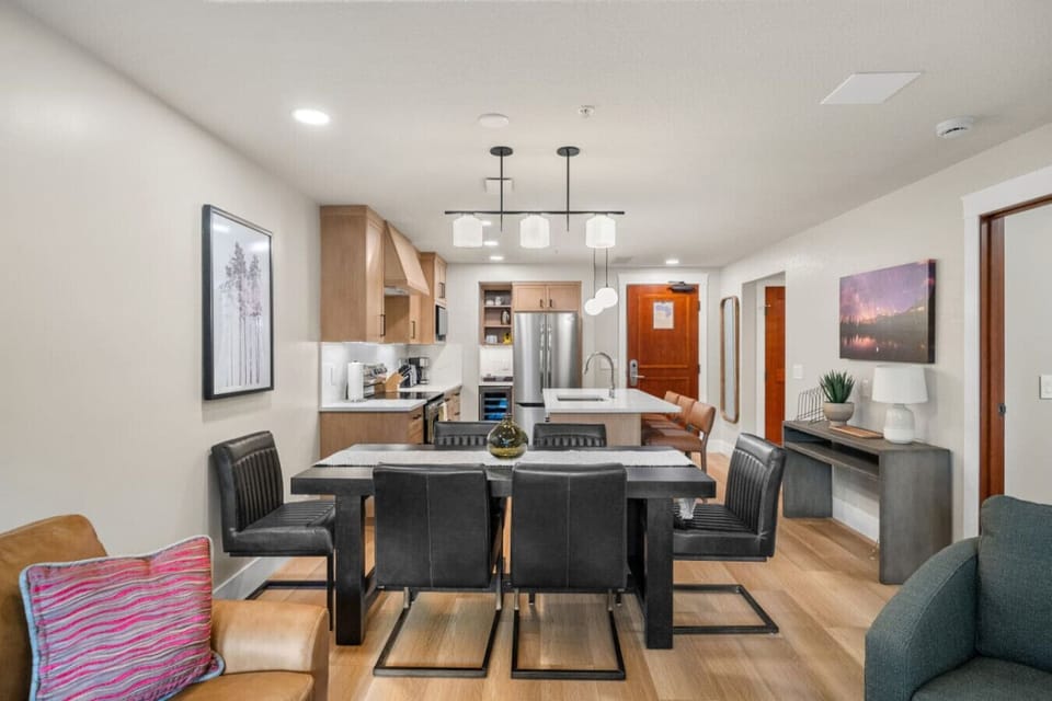 A wide view of the dining area and kitchen.