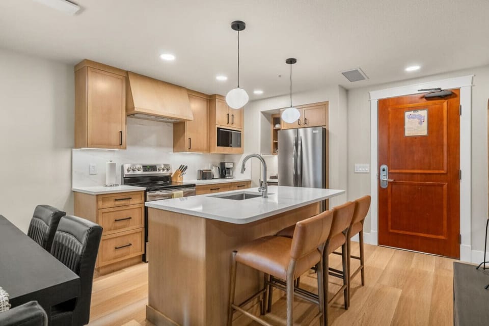 The spacious, modern kitchen with a large central island.