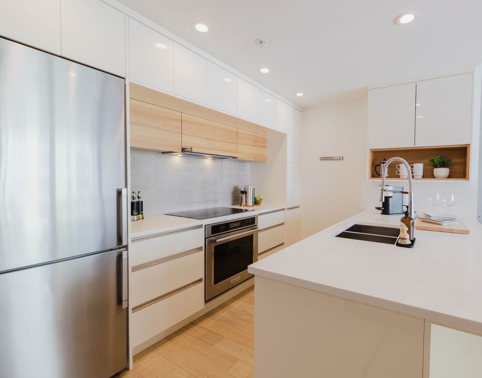 Stylish kitchen with premium appliances and ample workspace.