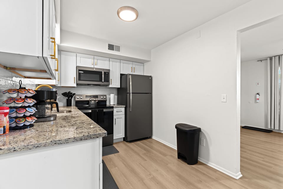 Bright kitchen and entryway area with modern finishes and easy flow into the rest of the home.