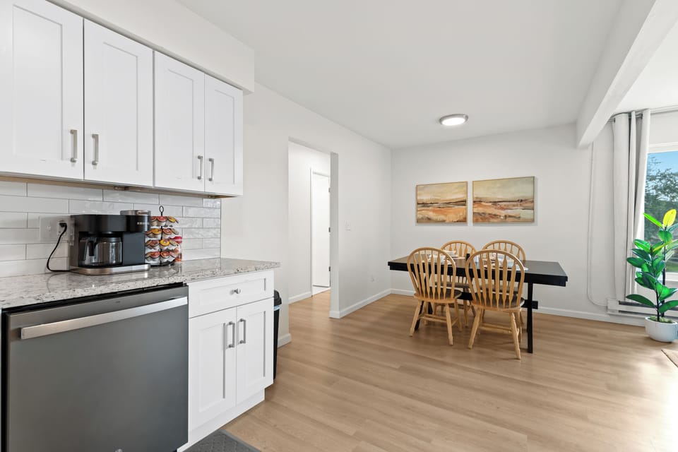 View from the kitchen into the dining area, highlighting the unit’s spacious and open layout.