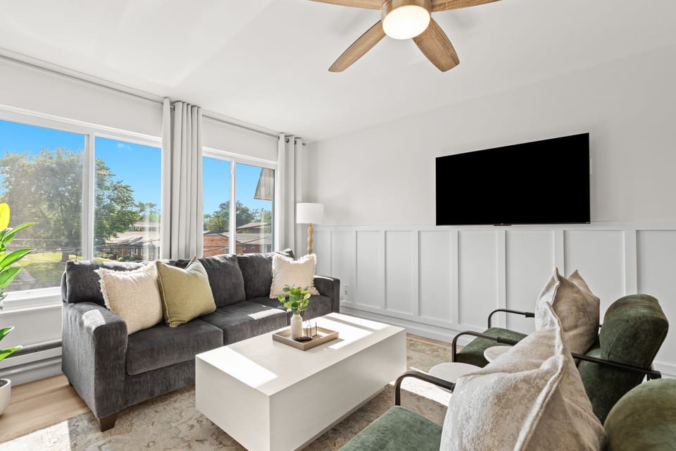 Modern and inviting living space with plush seating and direct views of the outdoors.