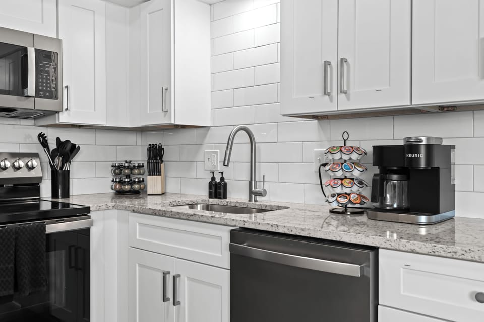 Updated kitchen with sleek finishes, full-size appliances, and coffee essentials ready for your stay.