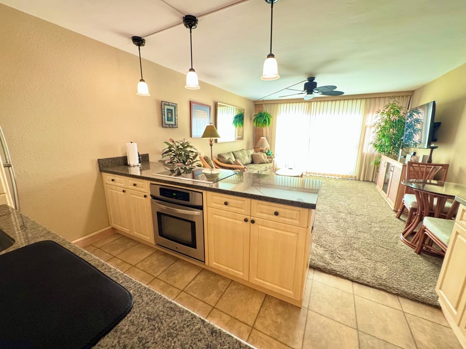 Full kitchen with electric stove and oven.