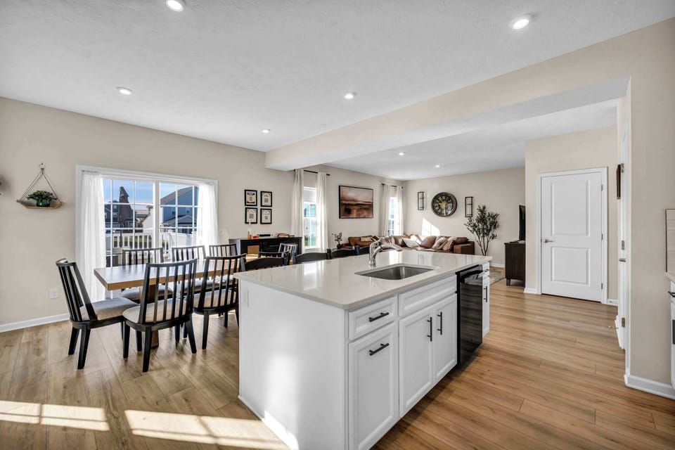 Enjoy meals and moments together at the large dining table for eight, with extra seating at the counter for casual dining or morning coffee. A welcoming space designed for connection and comfort.