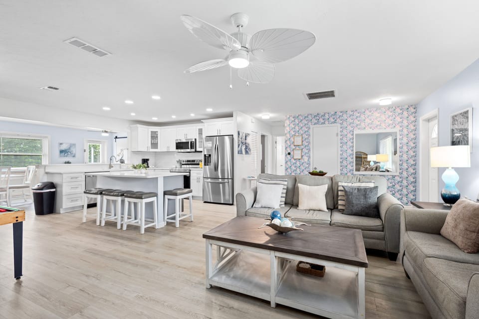 Bright, open kitchen and living room designed for easy flow and relaxed gatherings.
