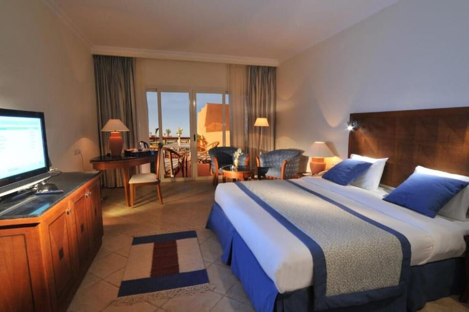 Relax in a bright retreat with seating and balcony access.