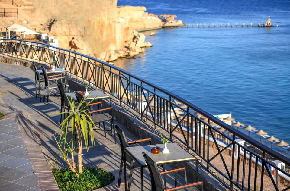 Relax on the cliff terrace with sweeping blue-water views.