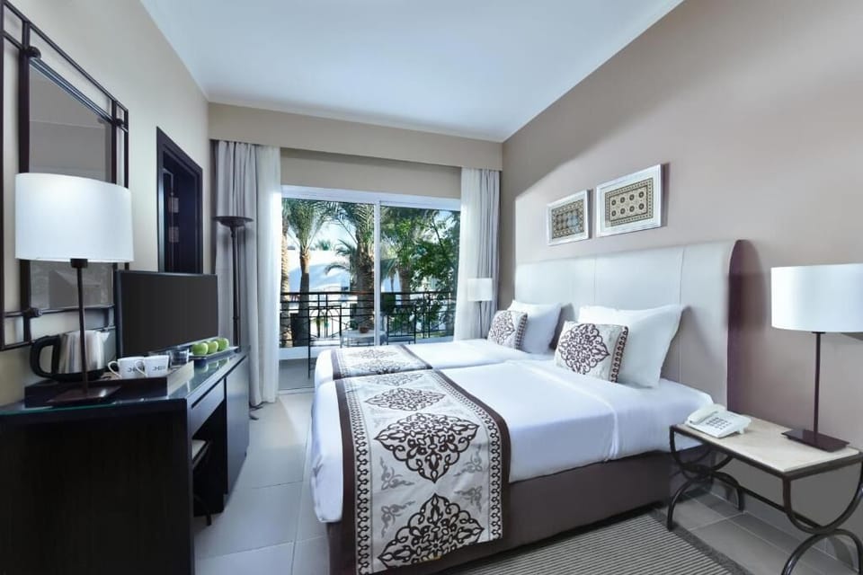 Wake refreshed in bright twin beds with palm views.