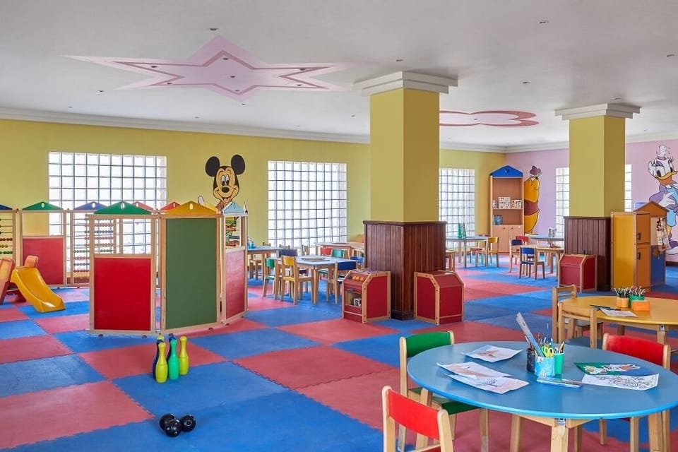 Encourage crafts and games in a cheerful, supervised-style playroom.