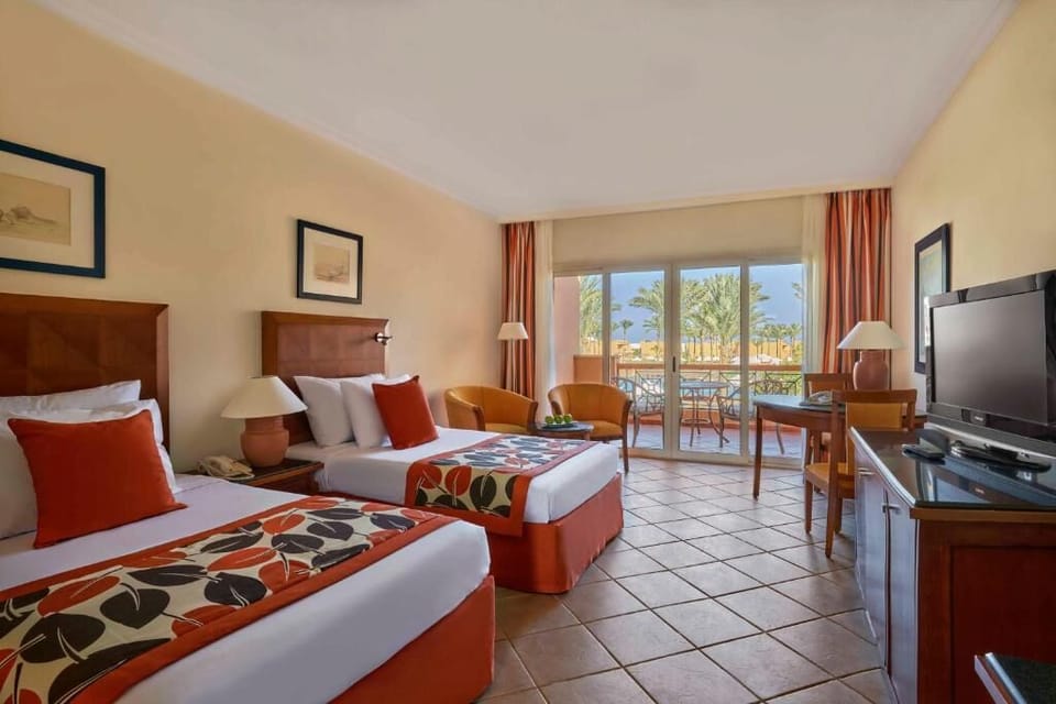 Recharge in twin beds after sunny balcony afternoons.