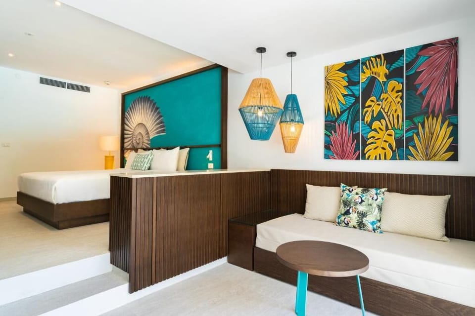 Lounge in style with colorful art and a cozy daybed nook.