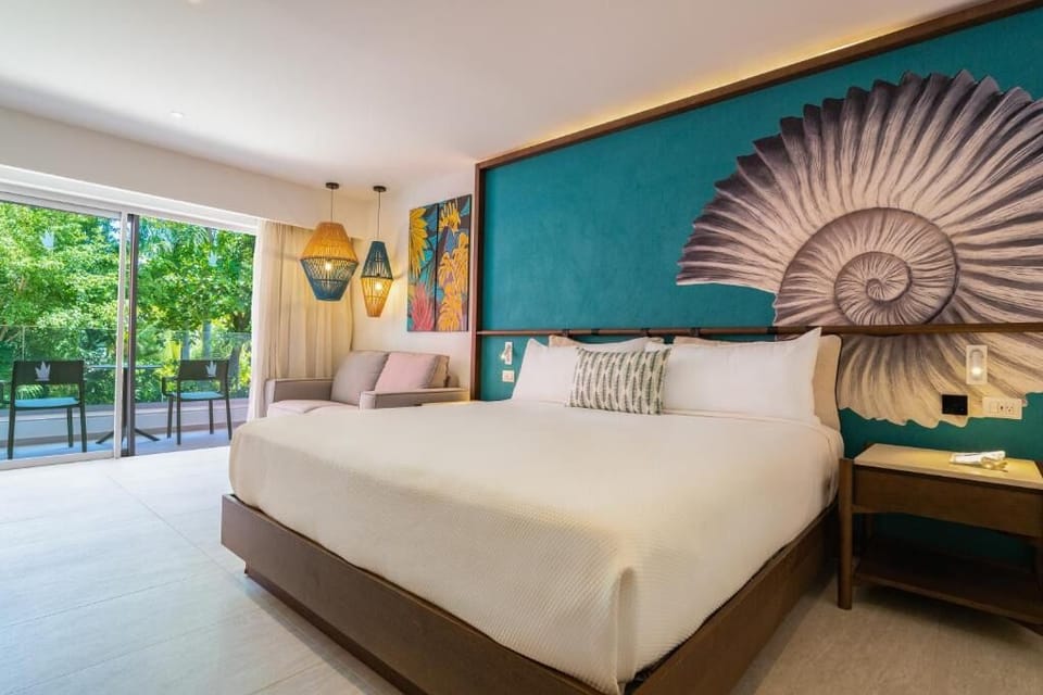 Unwind in a serene king bed beside lush terrace views